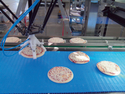 Dedicated ABB robots pick and place pizzas at the end ...